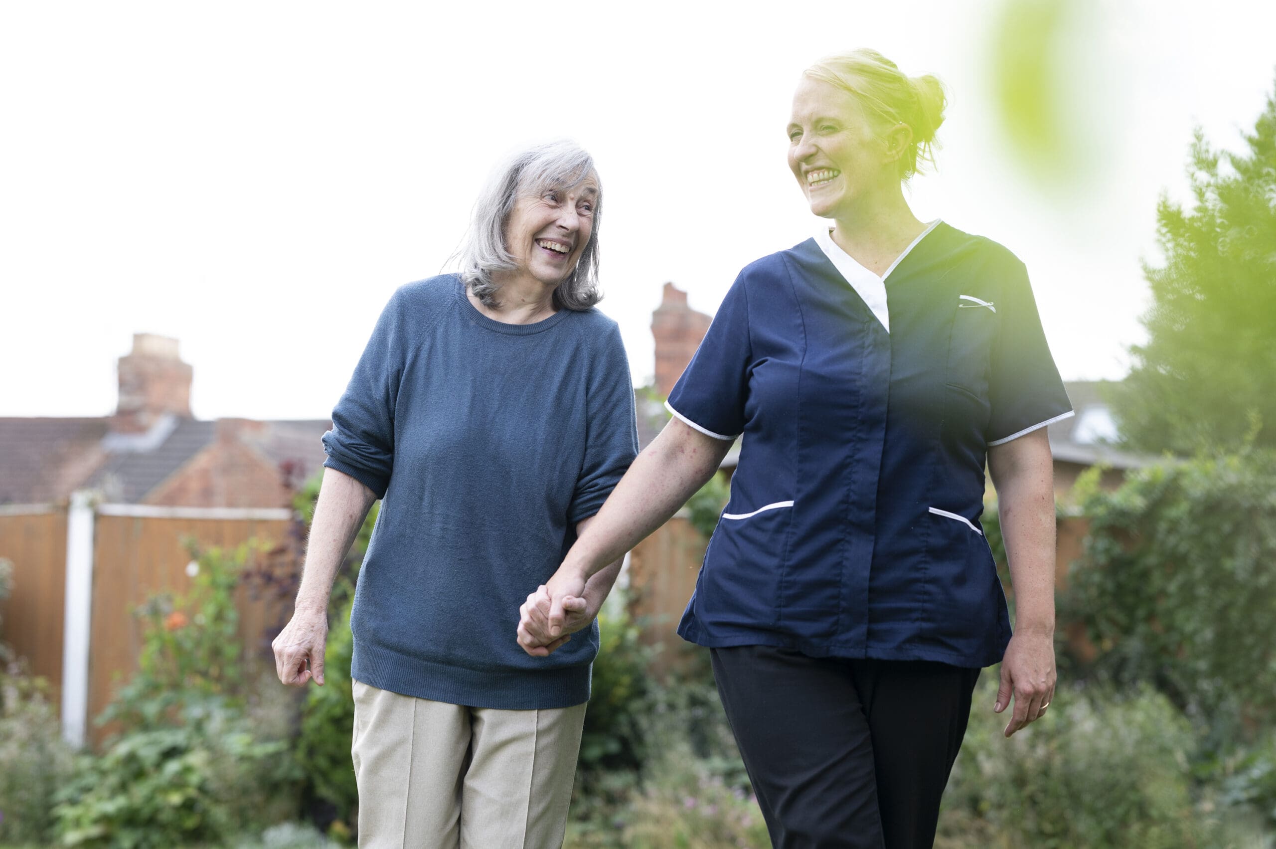 A resident walking with one of our team members