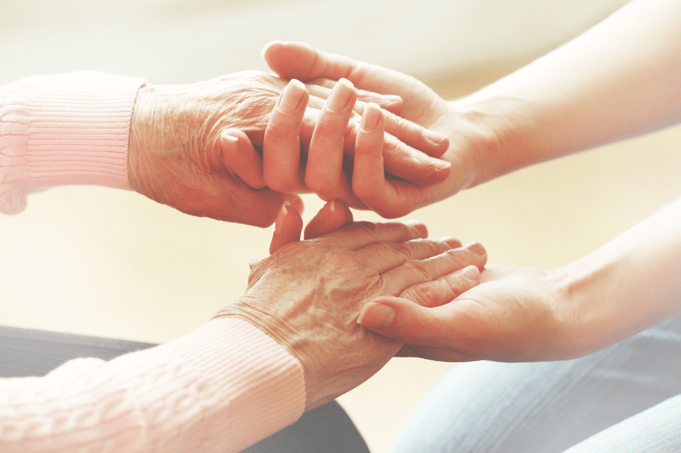 Elderly holding hands