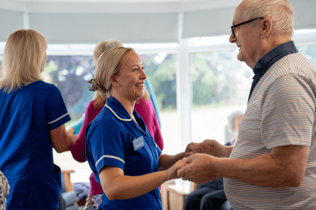 carer resident dancing for alzheimers care