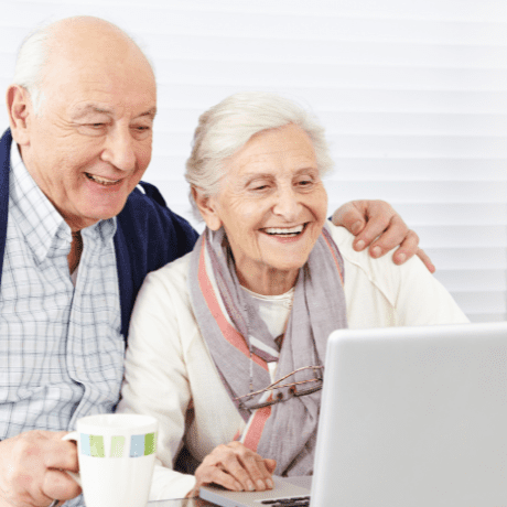 happy couple on laptop