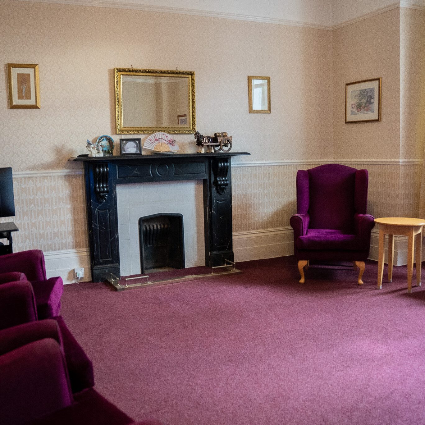 ACI | an image showing the fireplace in the communal lounge