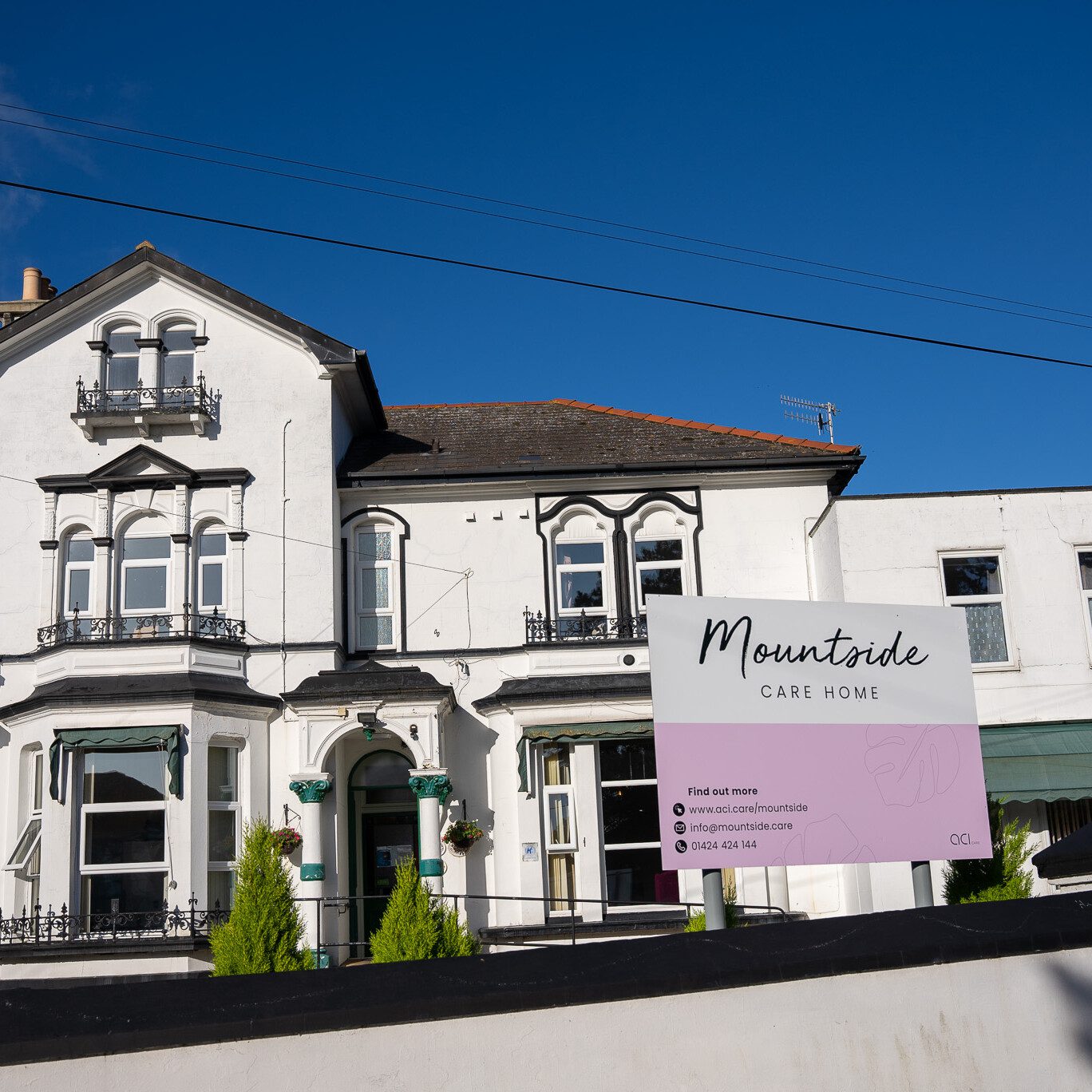 ACI | a wide angle outside image of Mountside Care Home including the front signage