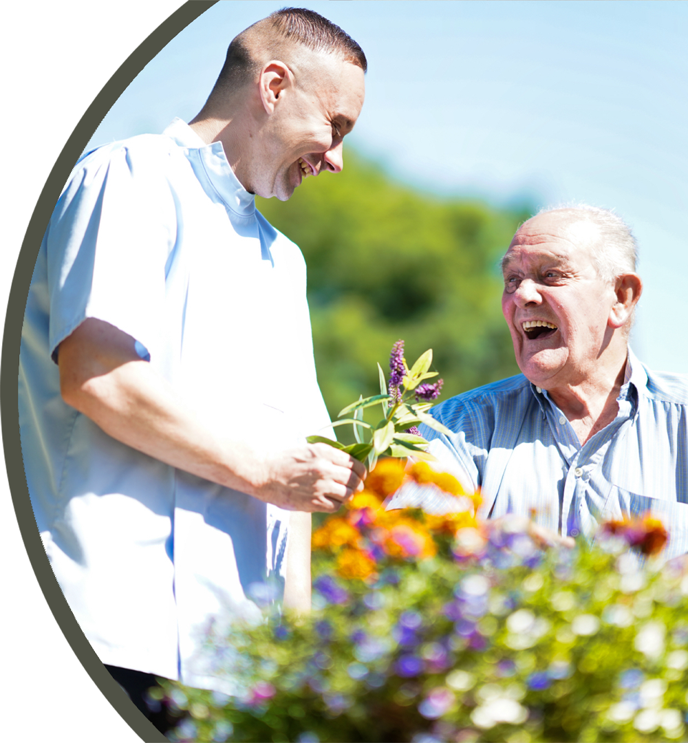 ACI | an image of a residents and member of staff smiling and laughing together